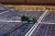 solar-worker-cleaning-photovoltaic-panels-with-brush-water-photovoltaic-cleaning.jpg