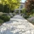 freepik__hyperrealistic-scene-of-a-pathway-leading-to-a-hou__446.webp